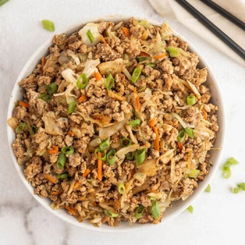 Ground beef stir-fry with vegetables in a white bowl, easy and delicious recipe.
