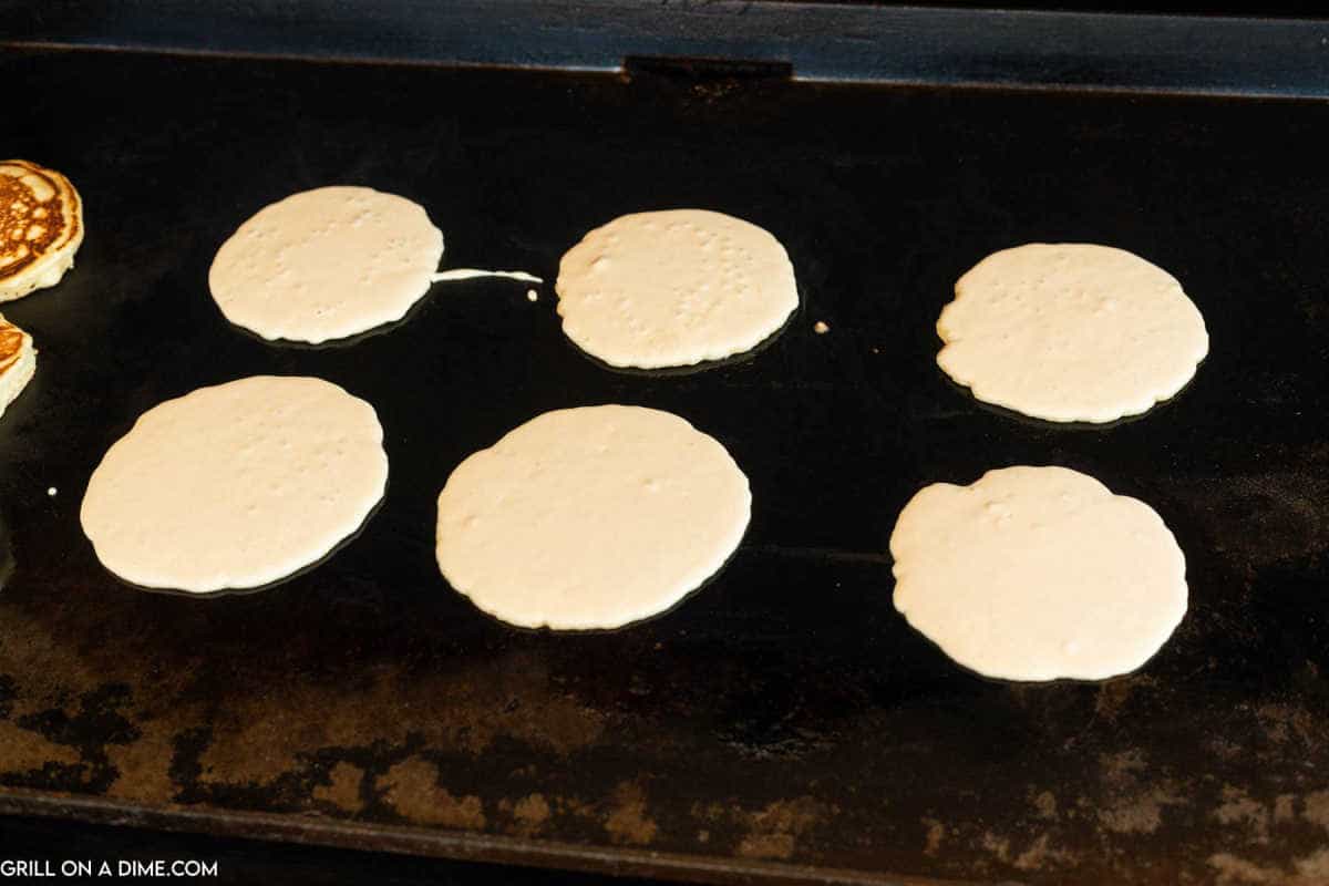 Pancake batter on a griddle.