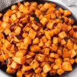 Diced grilled sweet potatoes on a plate