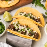 Mexican beef tacos on a cutting board.