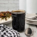 Rich black soy sauce in a glass jar for Asian-inspired cooking.