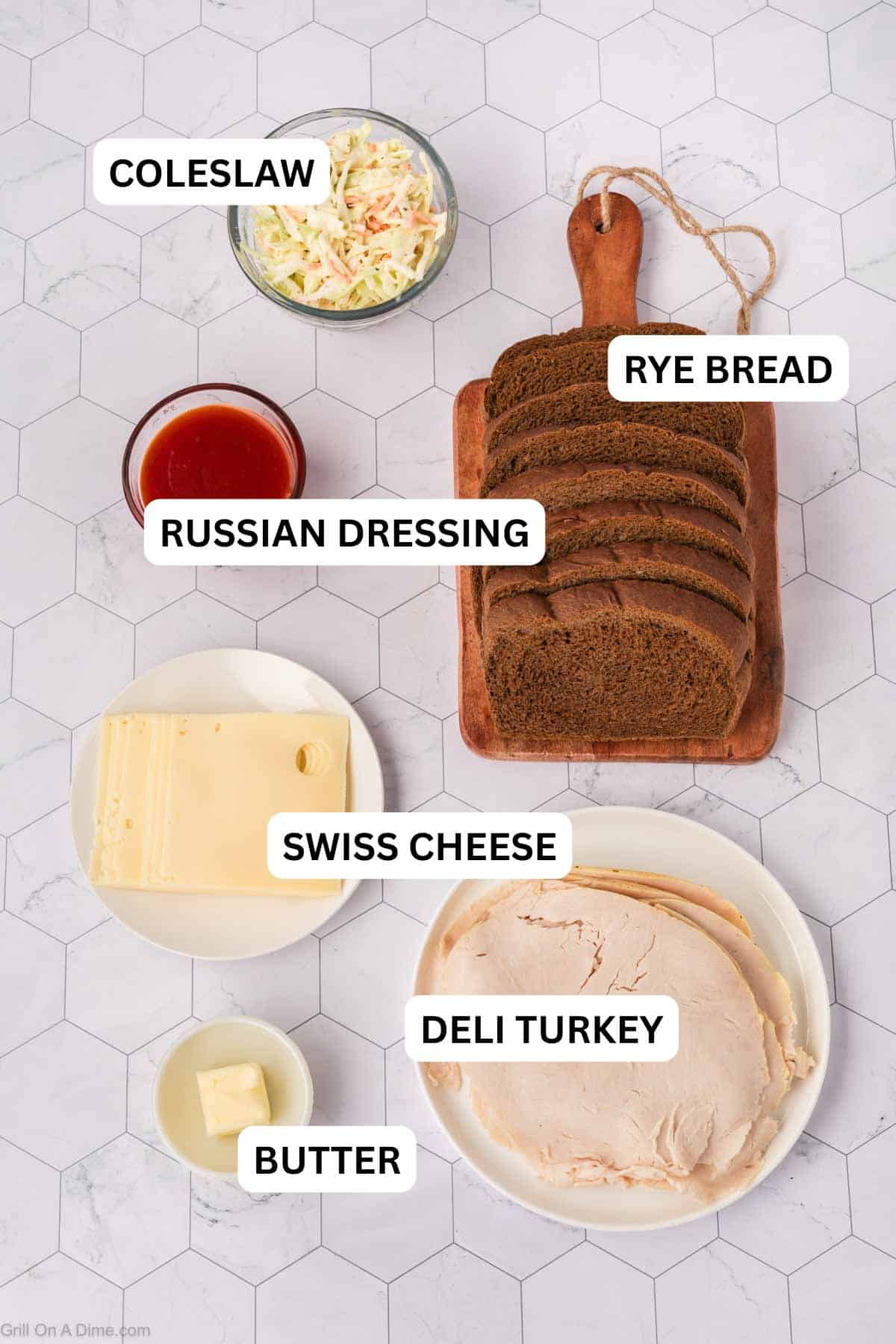 Ingredients needed for this recipe - Rye Bread, Russian Dressing, Swiss Cheese Slices, Deli Turkey, Butter, and coleslaw.