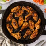 Crispy baked chicken drumsticks with a golden-brown crust on a skillet. Perfect for healthy dinner recipes and meal prep.