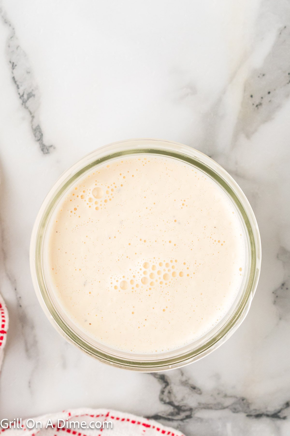 Creamy white sauce in a jar