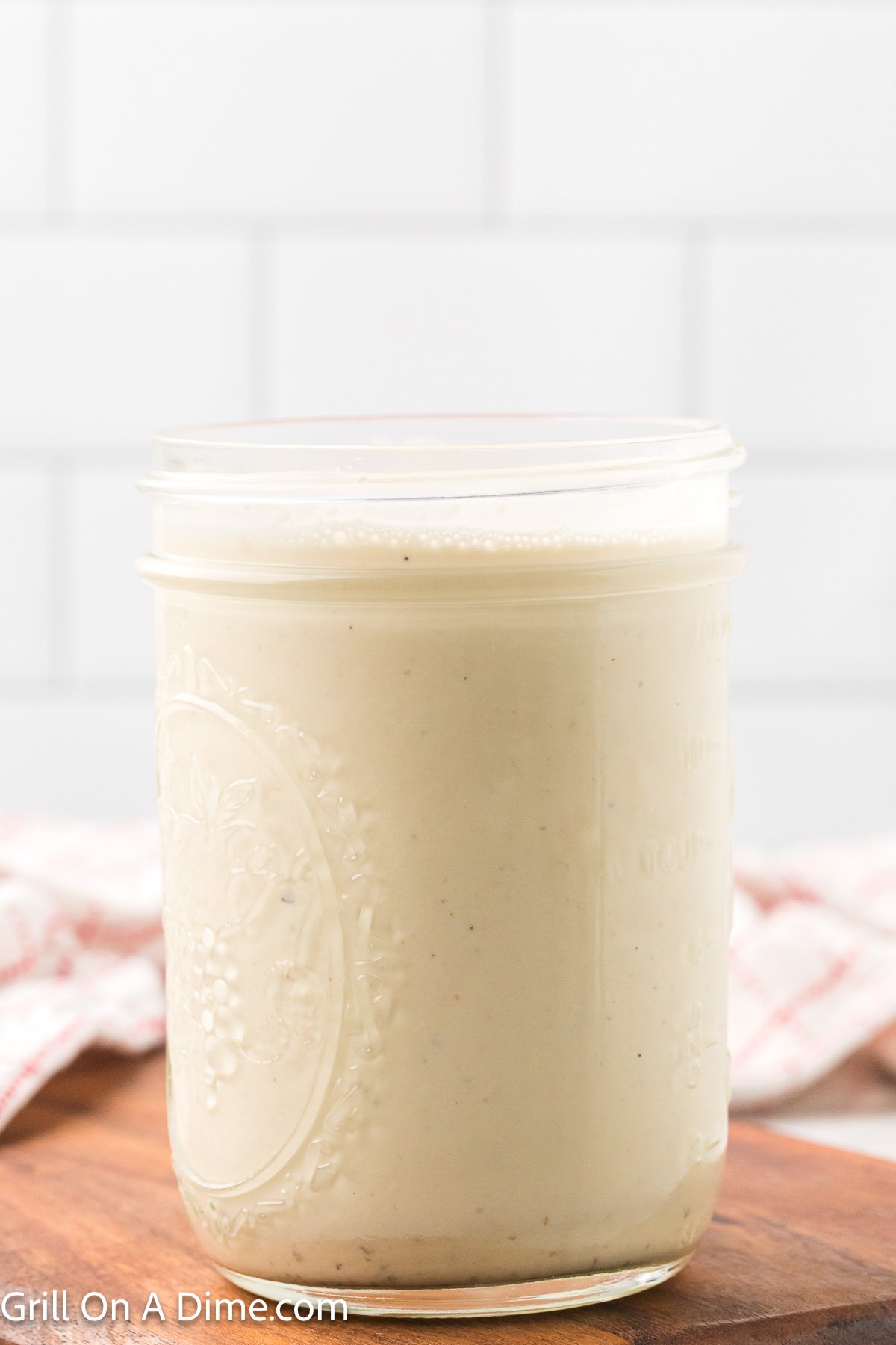 White sauce in a glass mason jar