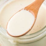 Homemade white sauce in a jar.