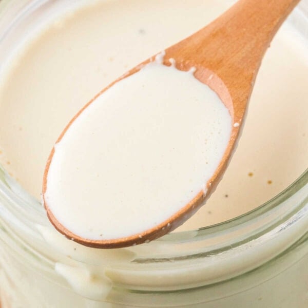 Homemade white sauce in a jar.