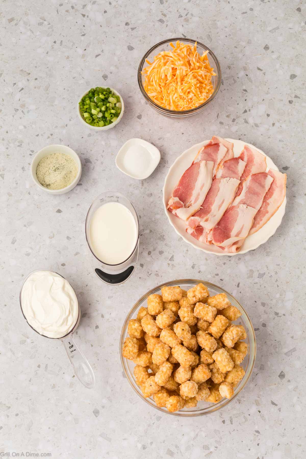 Ingredients - Tator Tots, bacon, sour cream, milk, salt, ranch dressing mix, green onions and shredded cheese