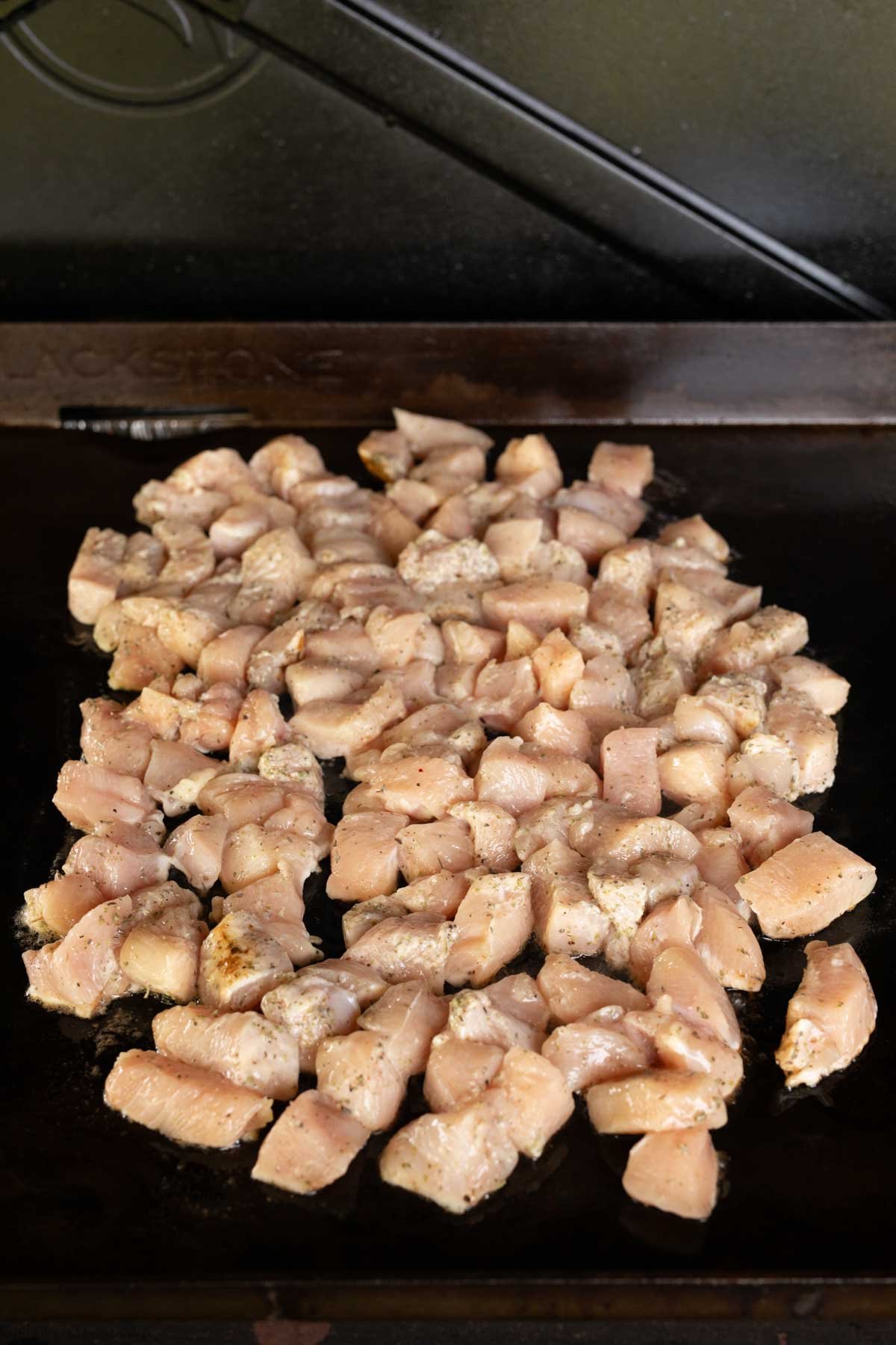 Raw chicken bites on the blackstone griddle