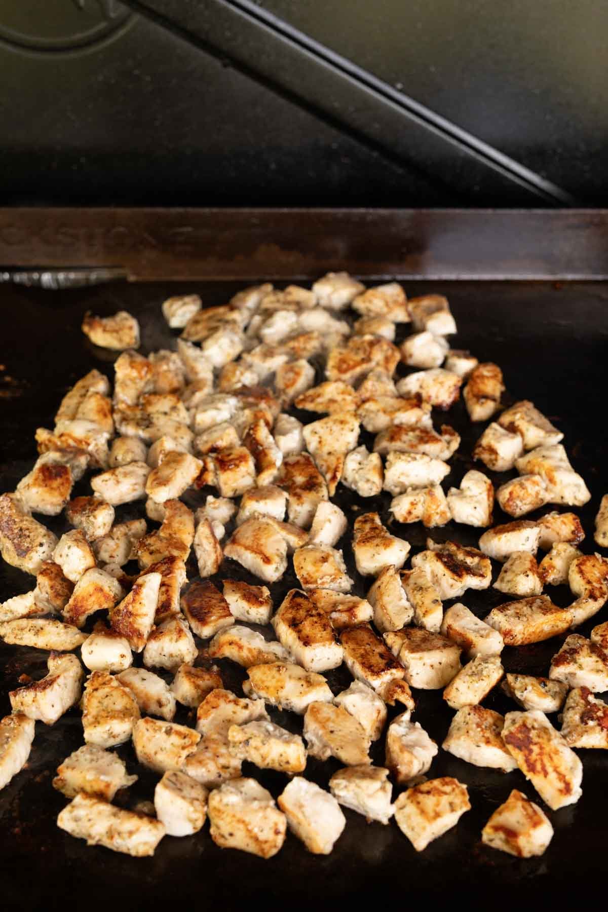 Cooked chicken bites on the Blackstone Griddle