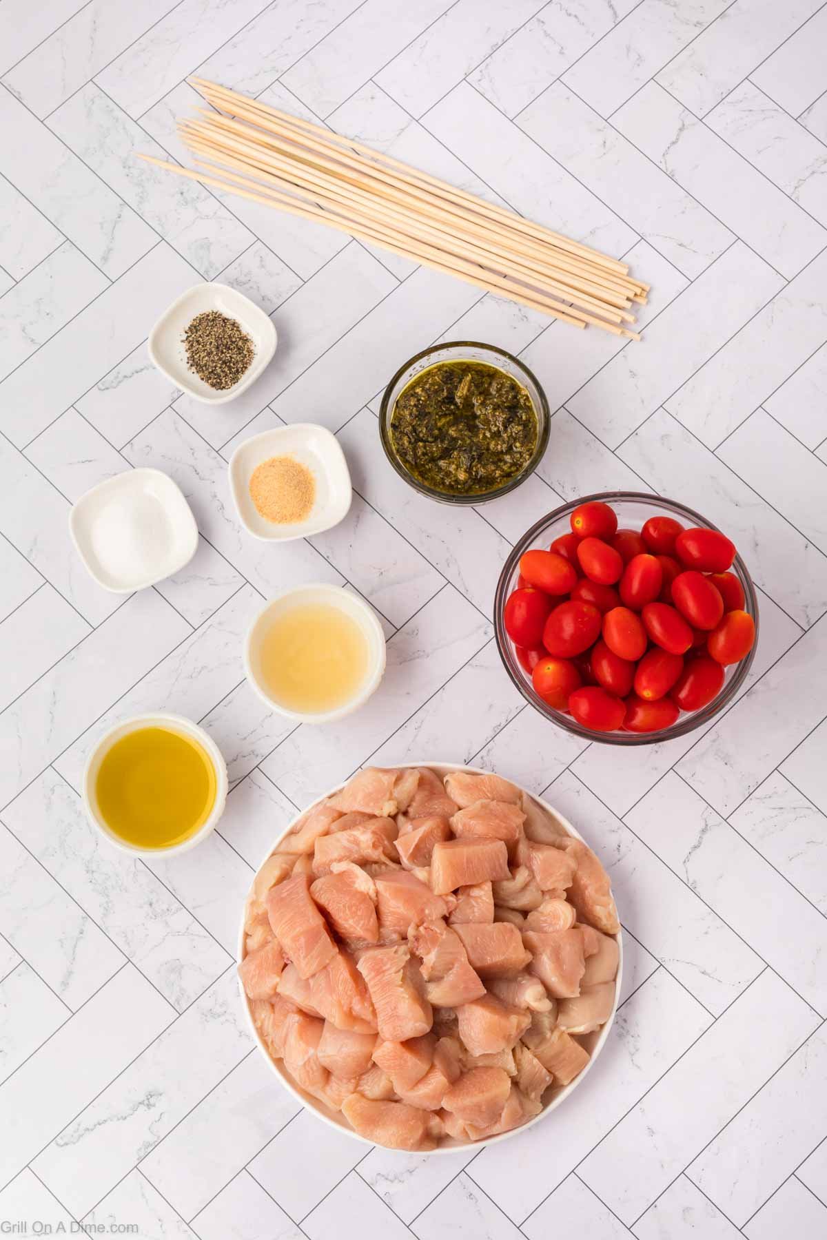 Ingredients - Chicken breast, basil pesto, olive oil, garlic powder, lemon juice, cherry tomatoes, salt and pepper