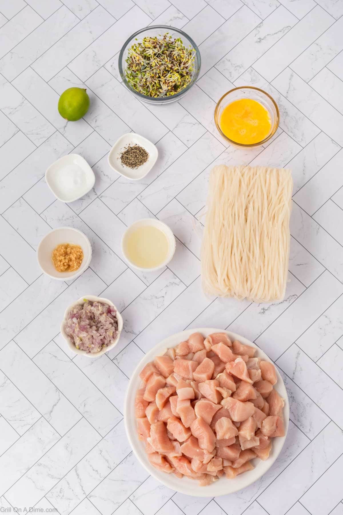 Ingredients - Dice chicken, shallots, minced garlic, noodles, eggs, salt, pepper, oil, lemon, bean sprouts