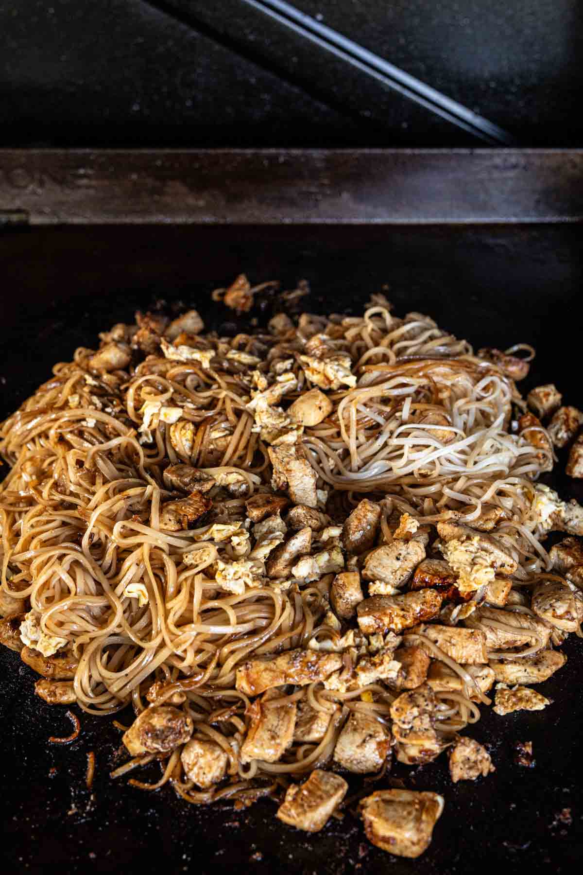 Cooking Pad Thai mixture on the griddle