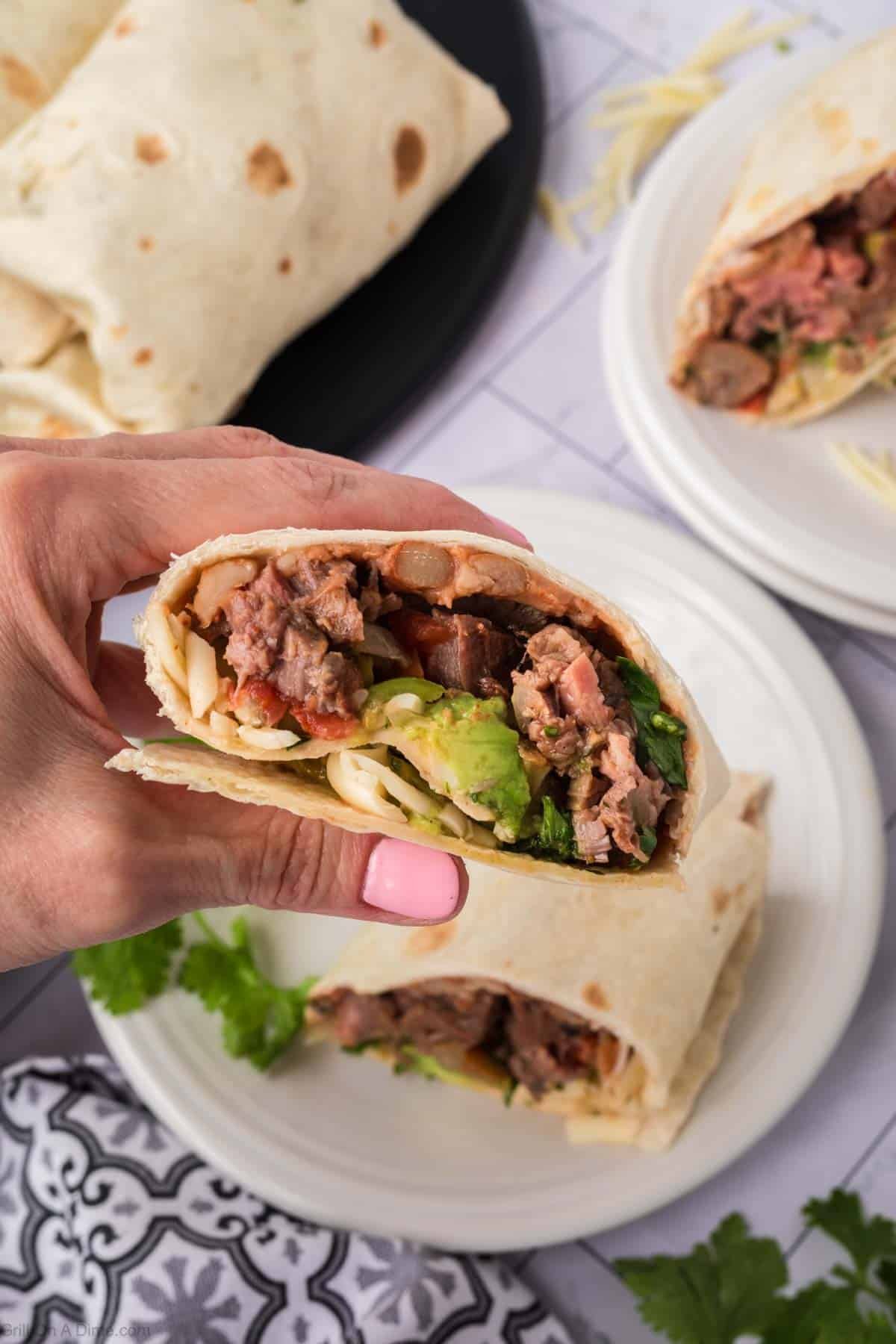 Carne Asada Burritos up close and being held