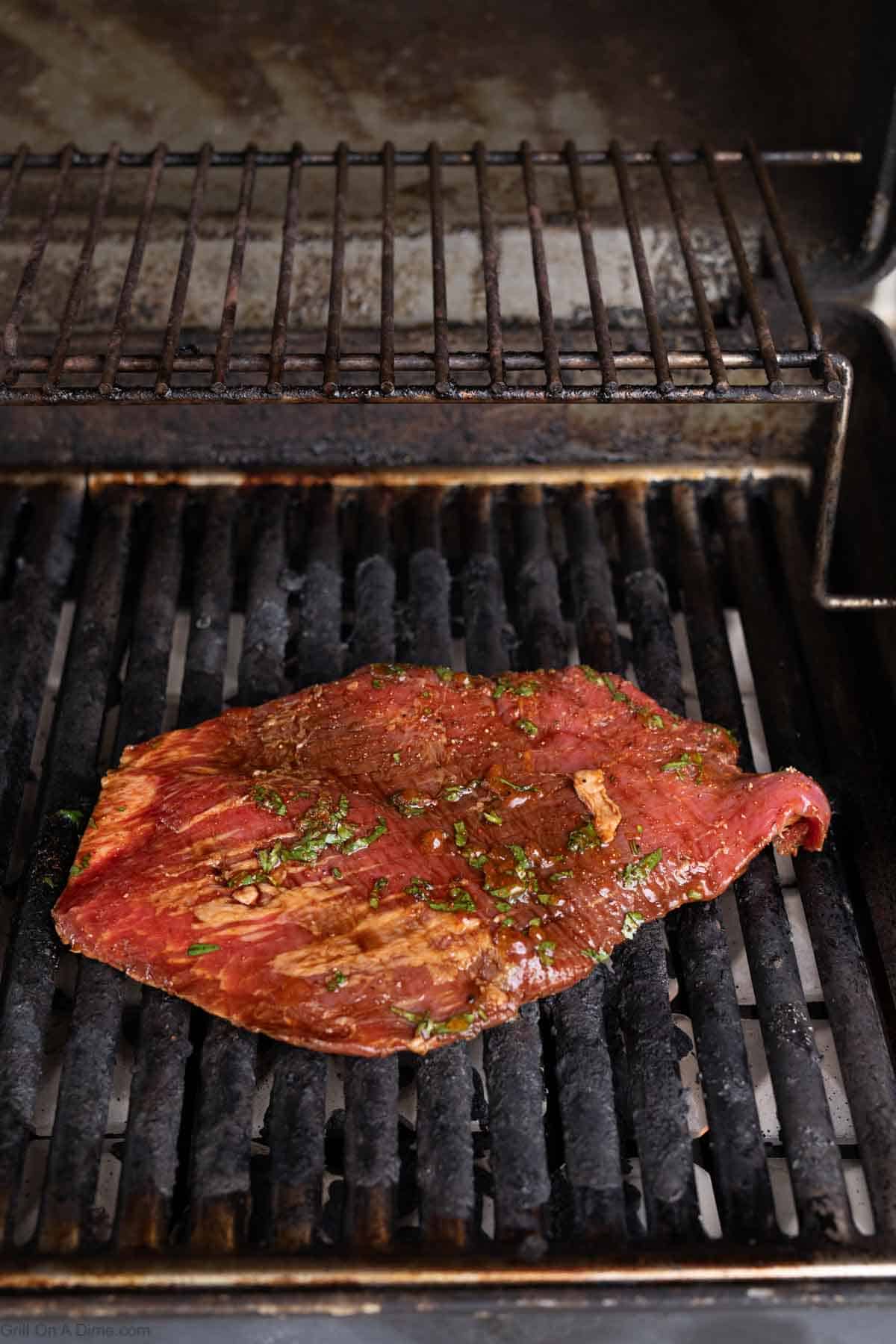 Place the marinated steak on the grill