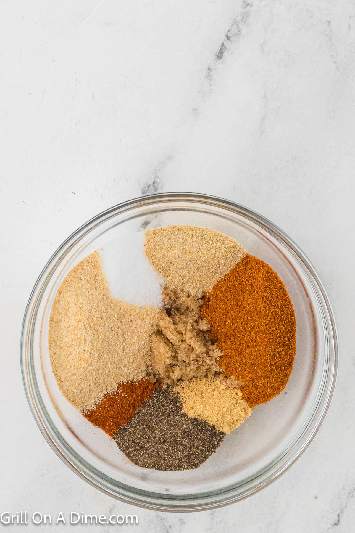 Combining the spices in a bowl