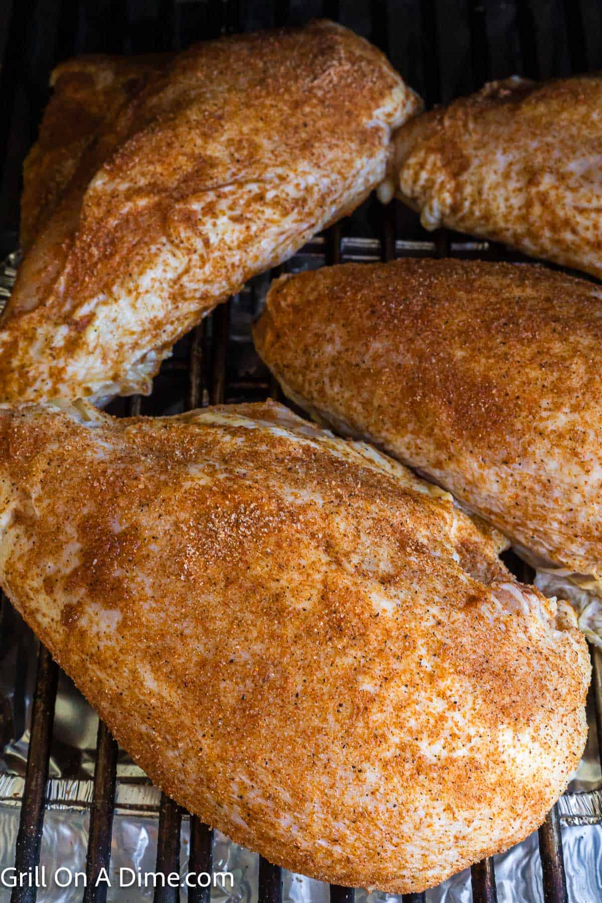 Placing the chicken breast on a grill rack
