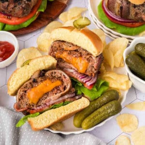 juicy stuffed burger patty with cheddar cheese, bacon, and toppings on sandwich bun