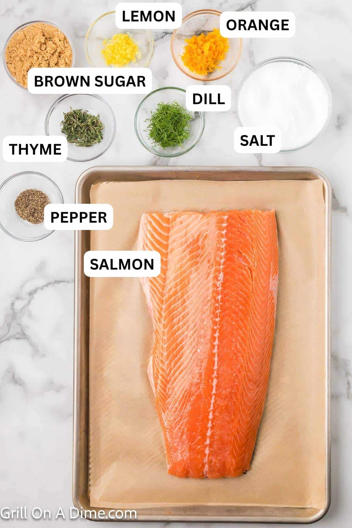Ingredients needed to make this recipe which includes Salmon Filet, salt, brown sugar, lemon zest, orange zest, fresh dill, and fresh thyme leaves.