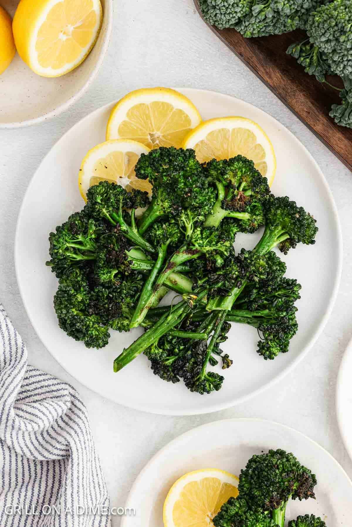 This recipe is served with lemon slices on a white plate. 