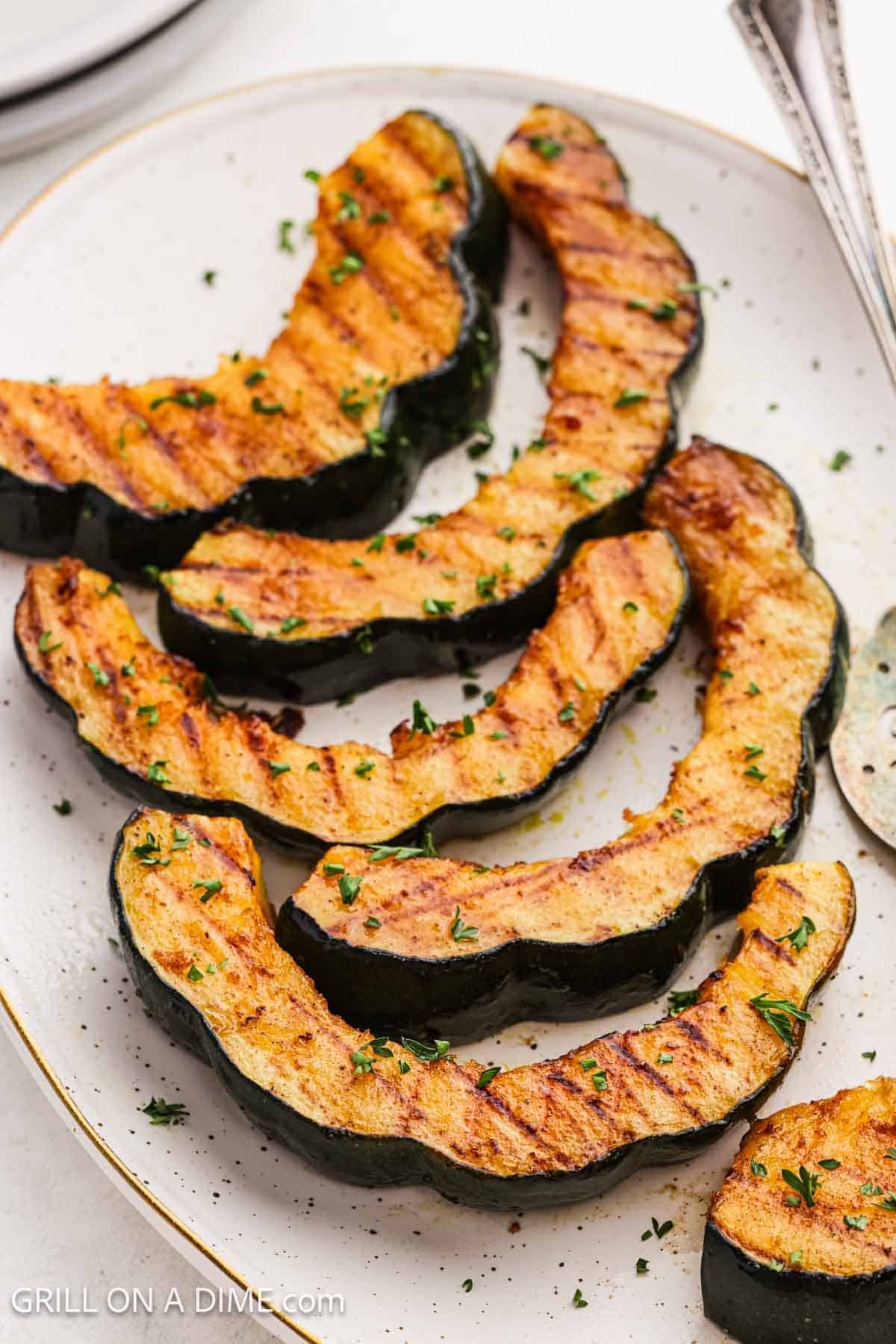 Slices of acorn squash on a platter.