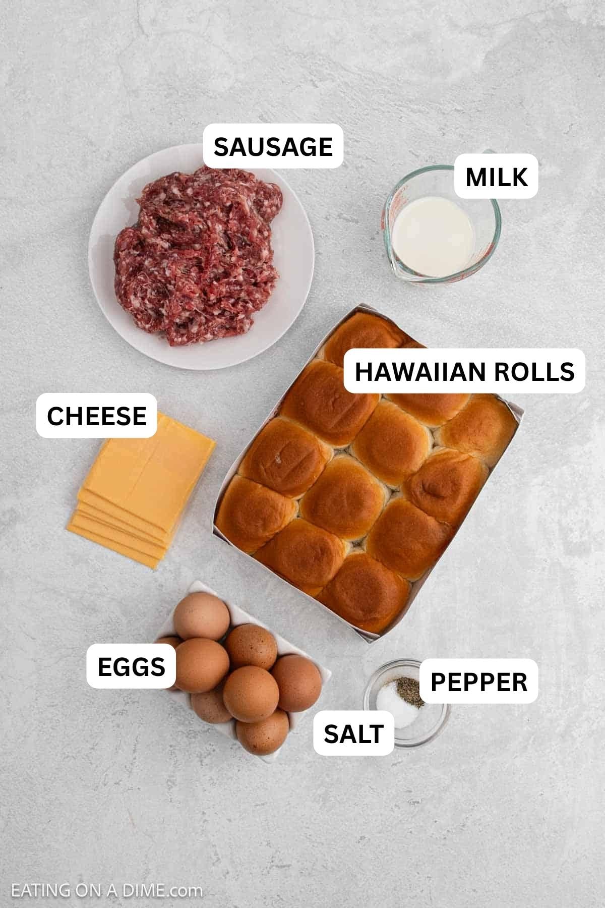 Ingredients needed to make this recipe which includes sausage, eggs, milk, salt, pepper, Hawaiian Sweet Rolls, and American cheese. 