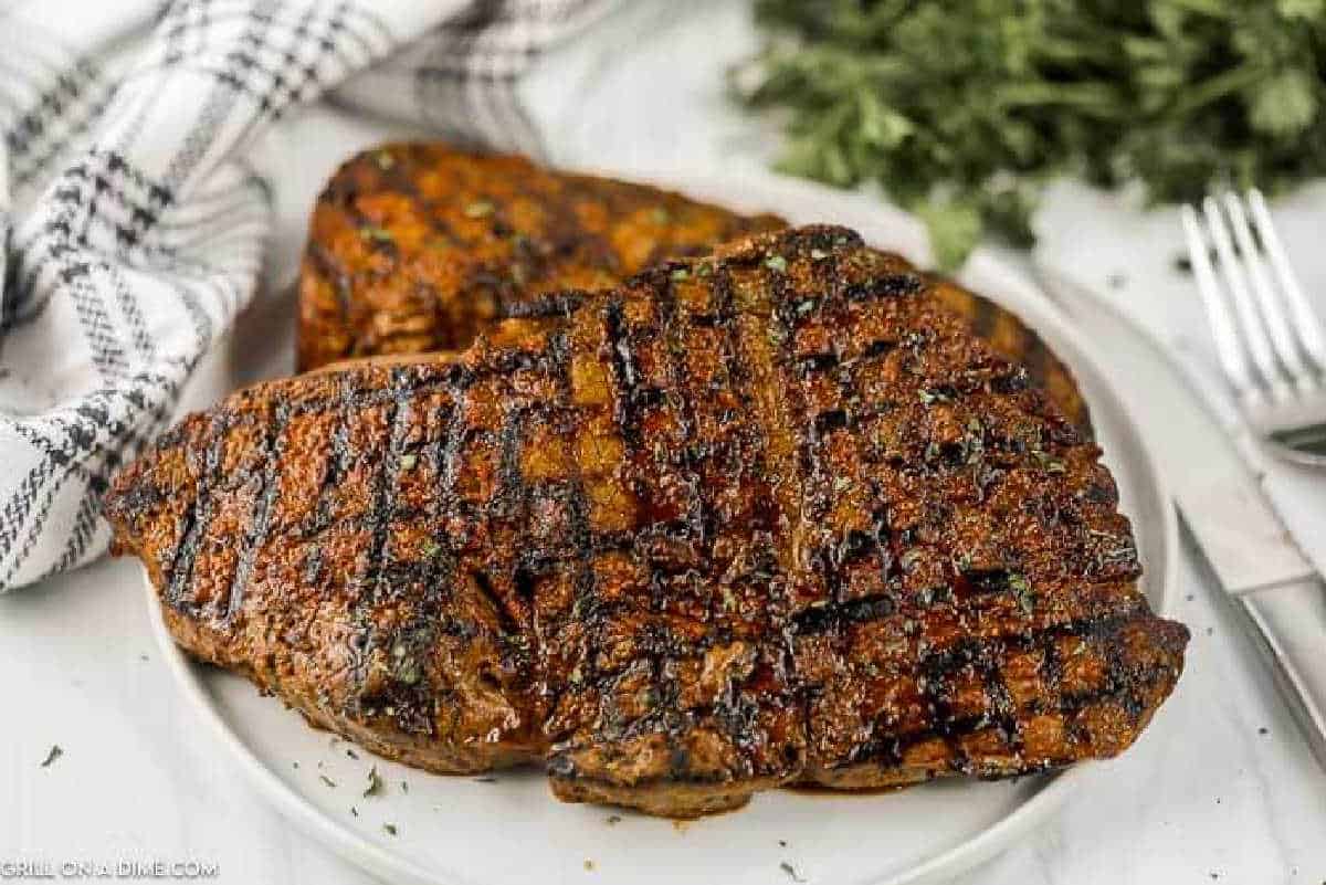 Texas Roadhouse Steak stacked on a plate. 