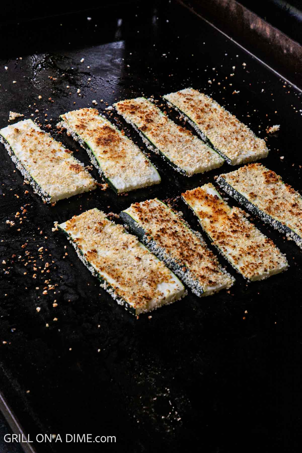 Cooking parmesan zucchini on the Blackstone griddle.