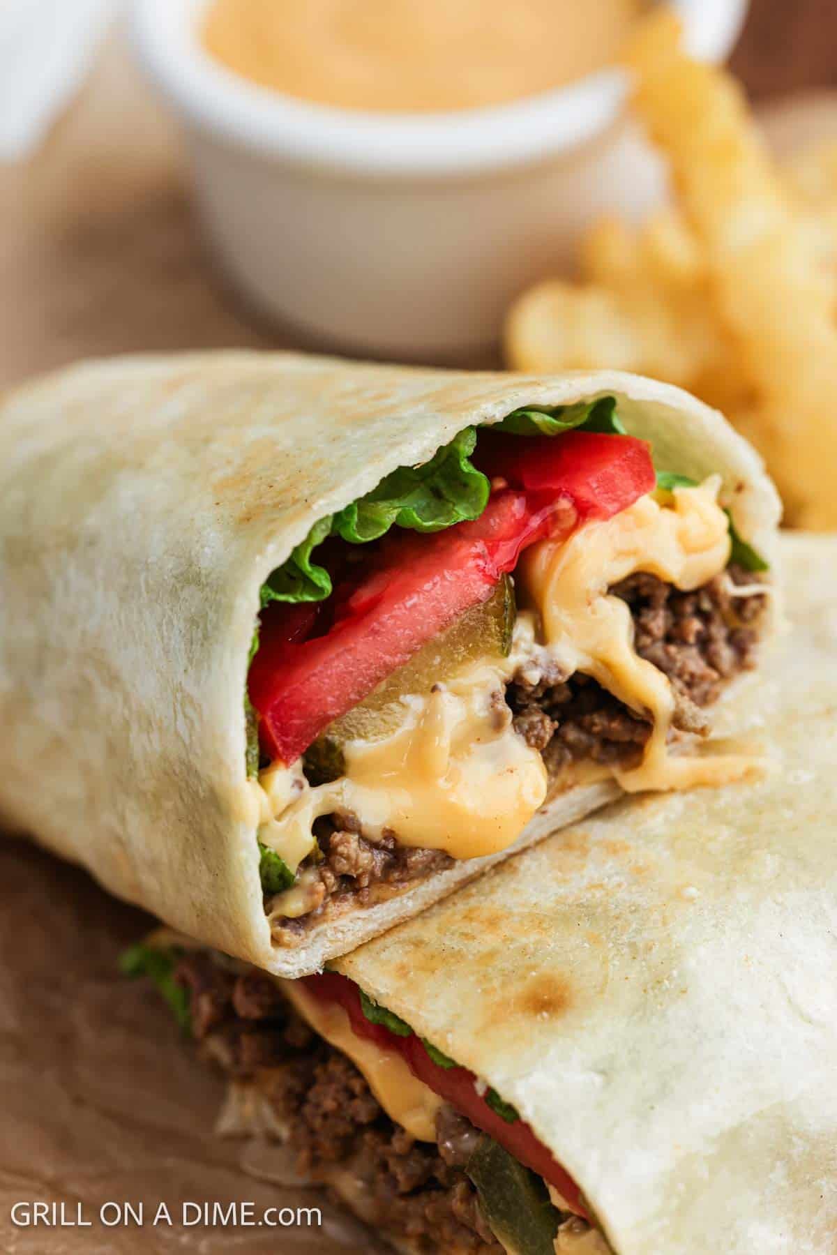 Ground beef wrap cut in half.