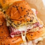 Ham and cheese sliders stacked on top of each other.