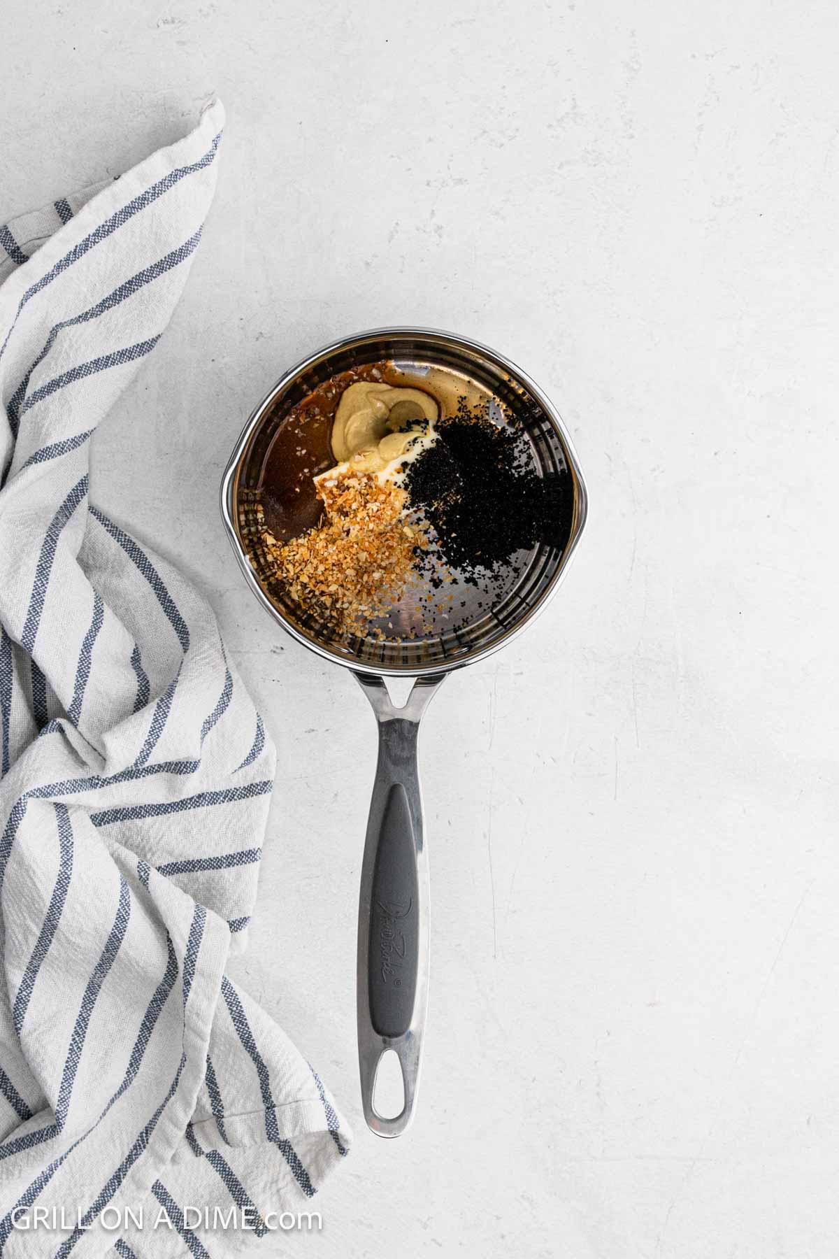Combining the buttery topping ingredients in the saucepan 