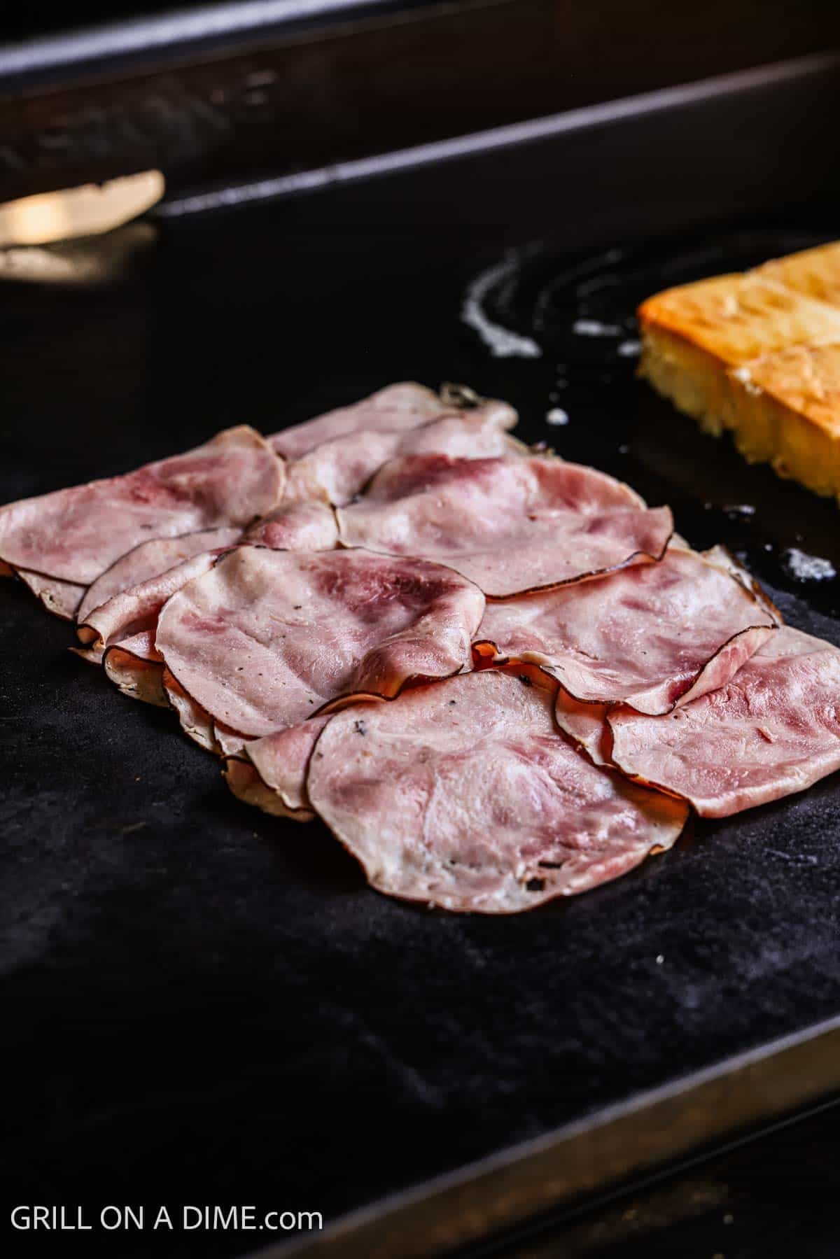 Deli ham placed on the Blackstone Griddle. 