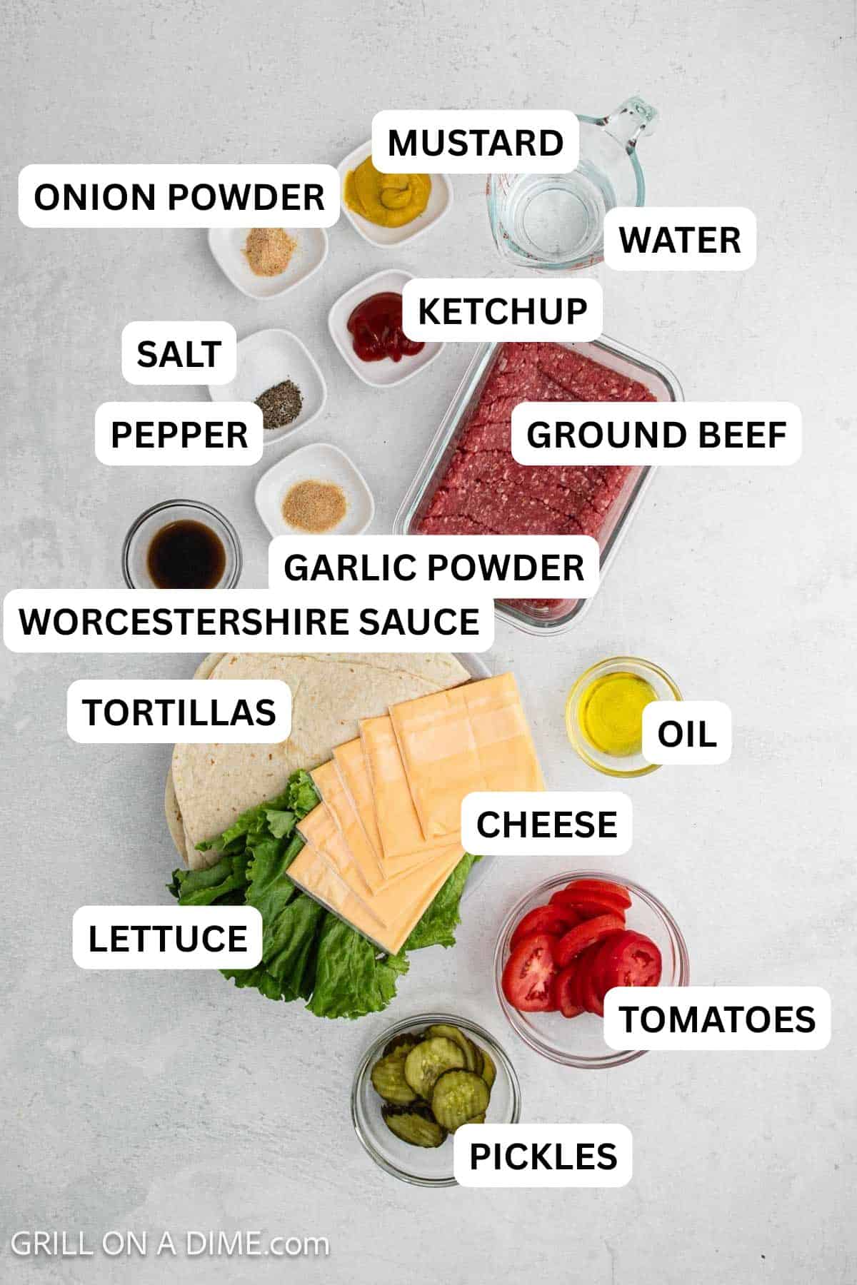 Ingredients needed to make this recipe which includes, ground beef, oil, worcestershire sauce, mustard, ketchup. spices, toppings and tortillas.
