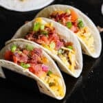 Breakfast tacos on the Blackstone in a taco stand.