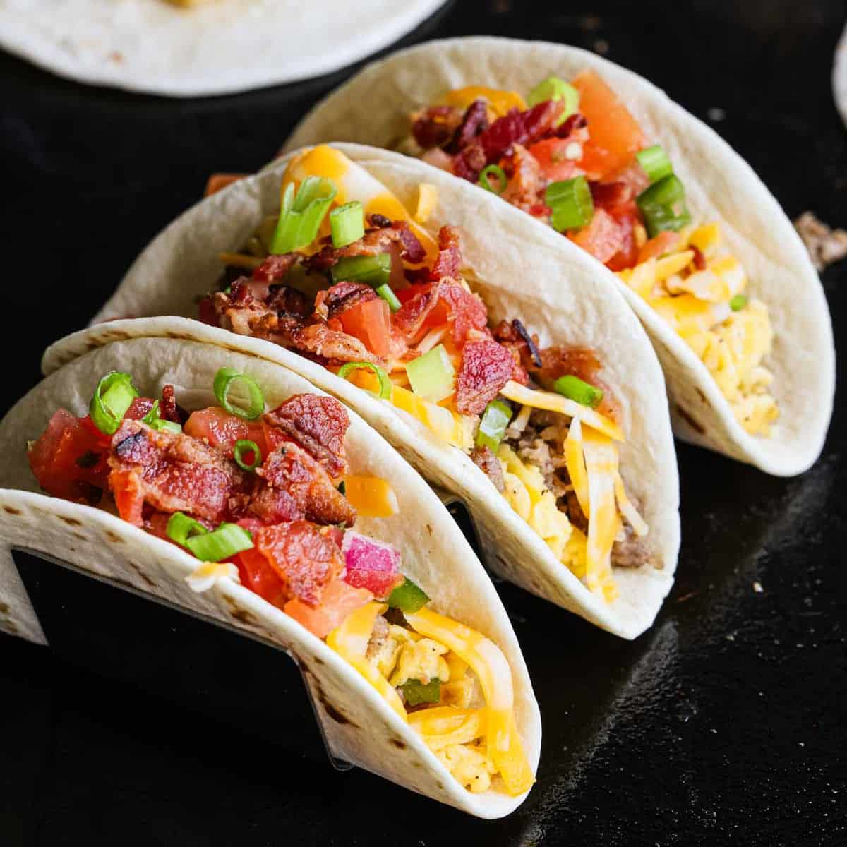 Breakfast tacos on the Blackstone in a taco stand.